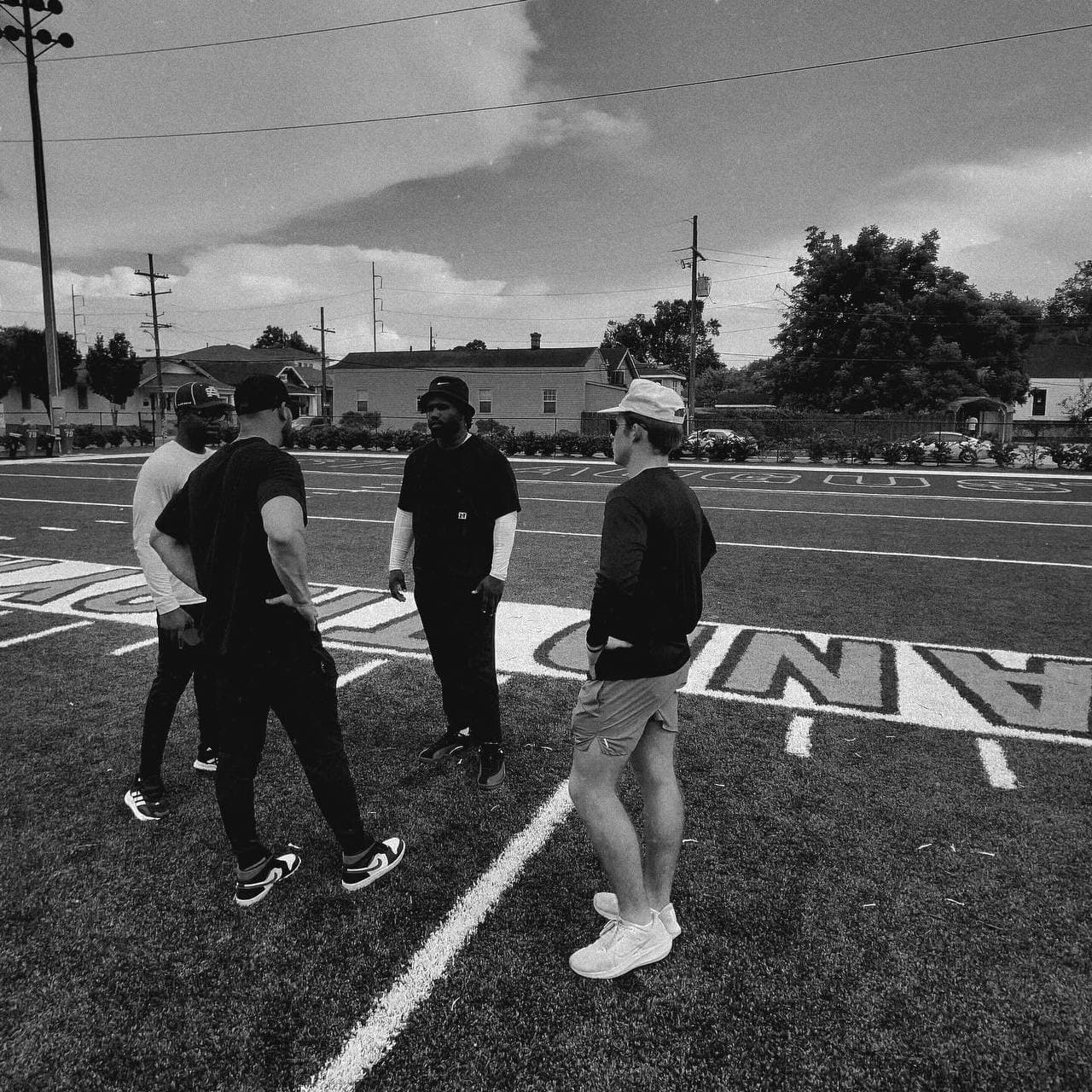 Coaching staff on field