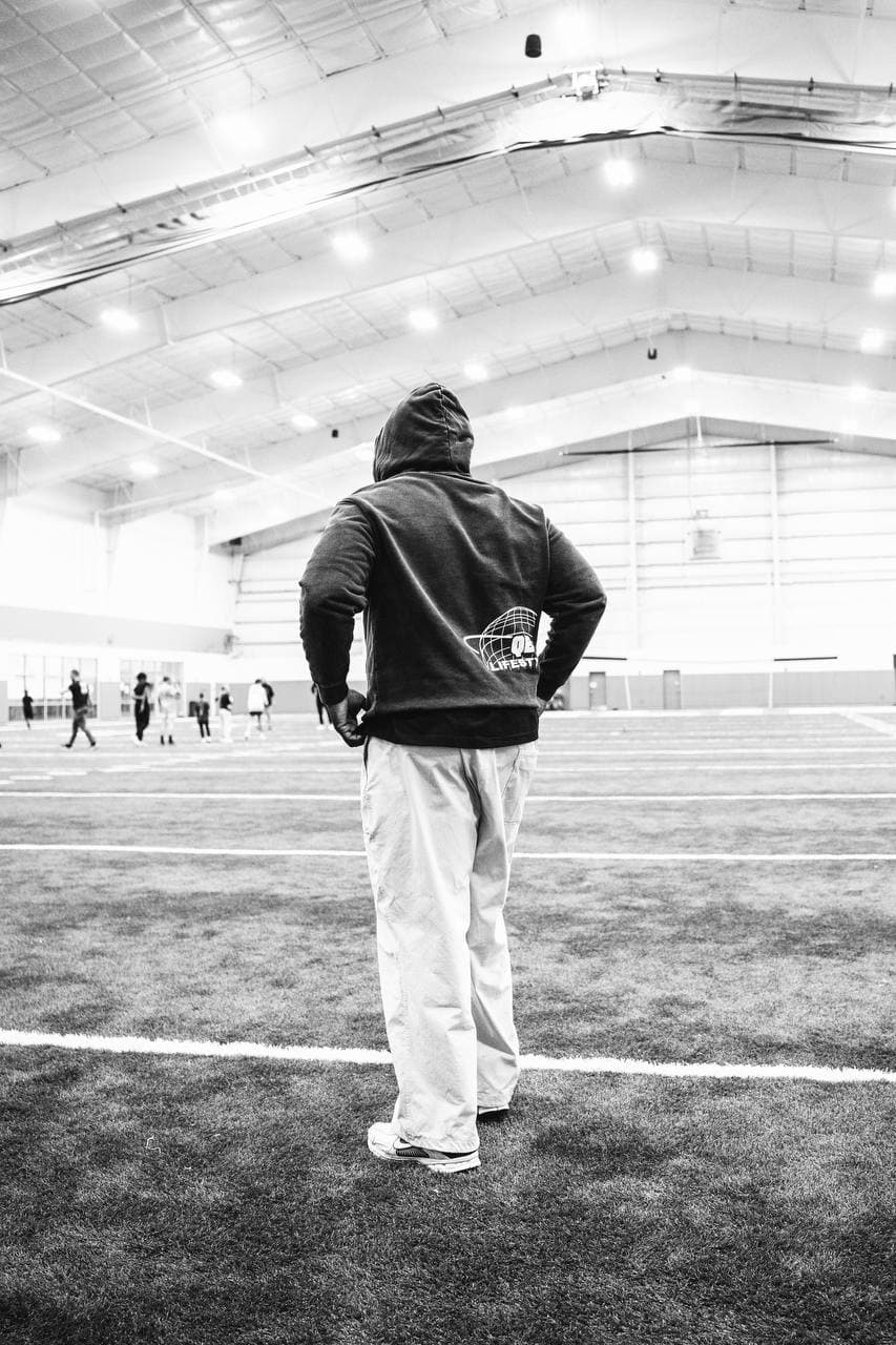 Coach overlooking practice
